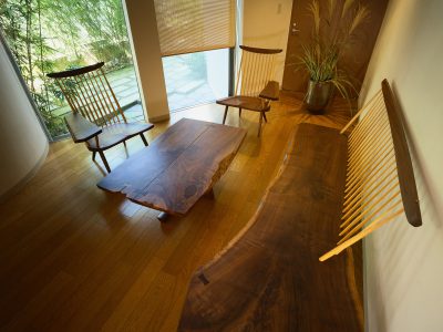 Furniture designed by George Nakashima graces a garden room in an Osaka house designed by Chitoshi Kihara.